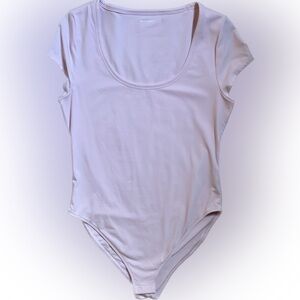 Soft pink, scoop neck tee shirt body suit.
